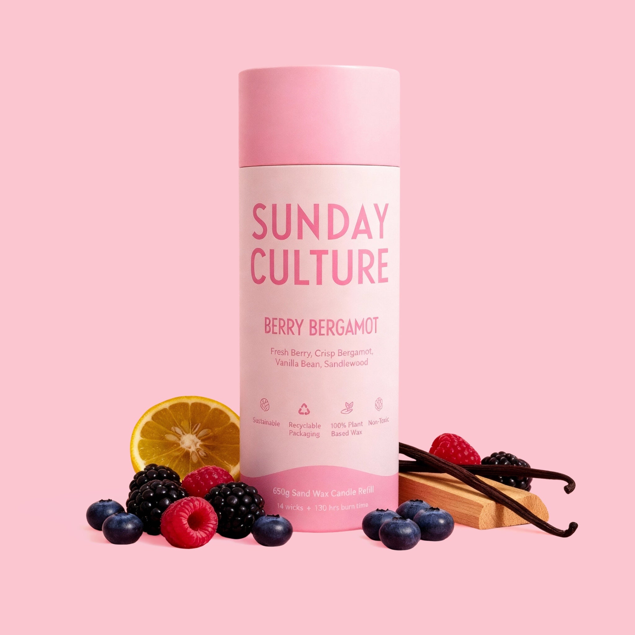 Sunday Culture berry bergamot product with fruits and vanilla beans on a pink background
