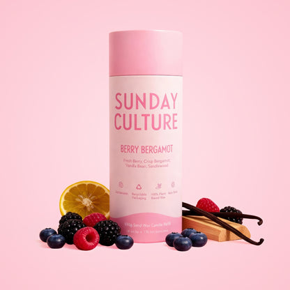 Sunday Culture berry bergamot product with fruits and vanilla beans on a pink background