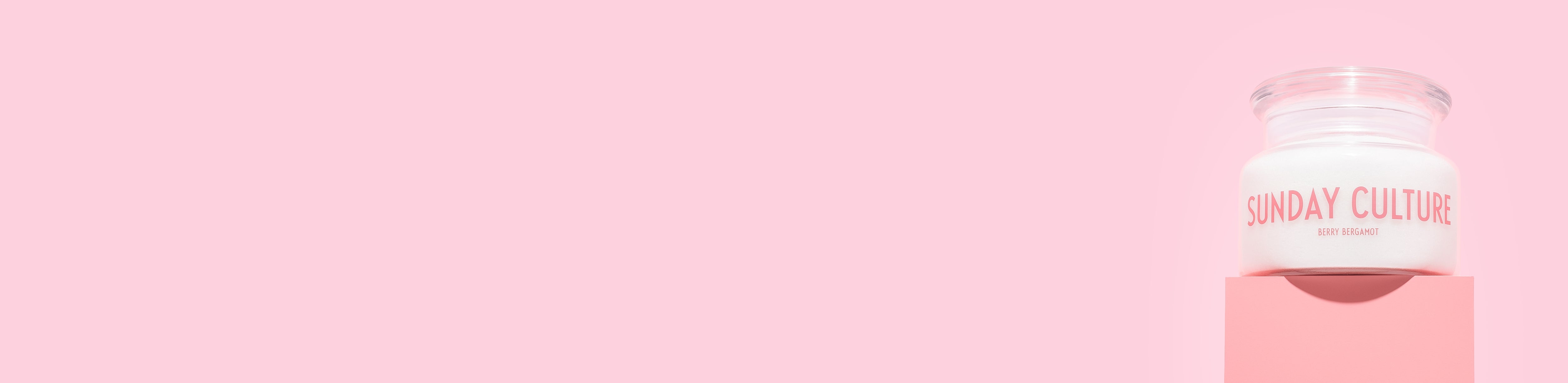 Sunday Culture sand wax candle on a pink background