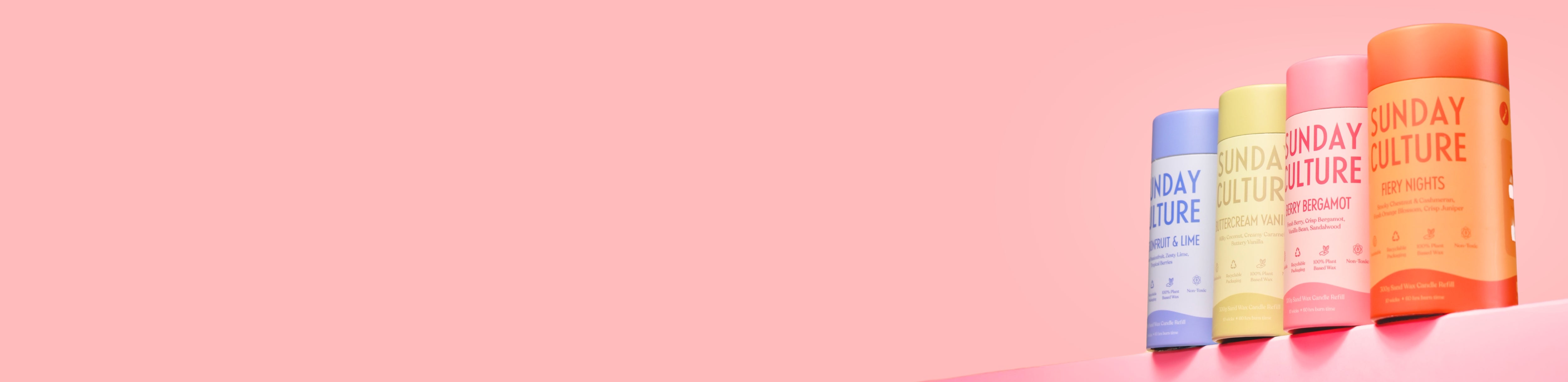 Sunday Culture sand wax tubes in a line on a pink background