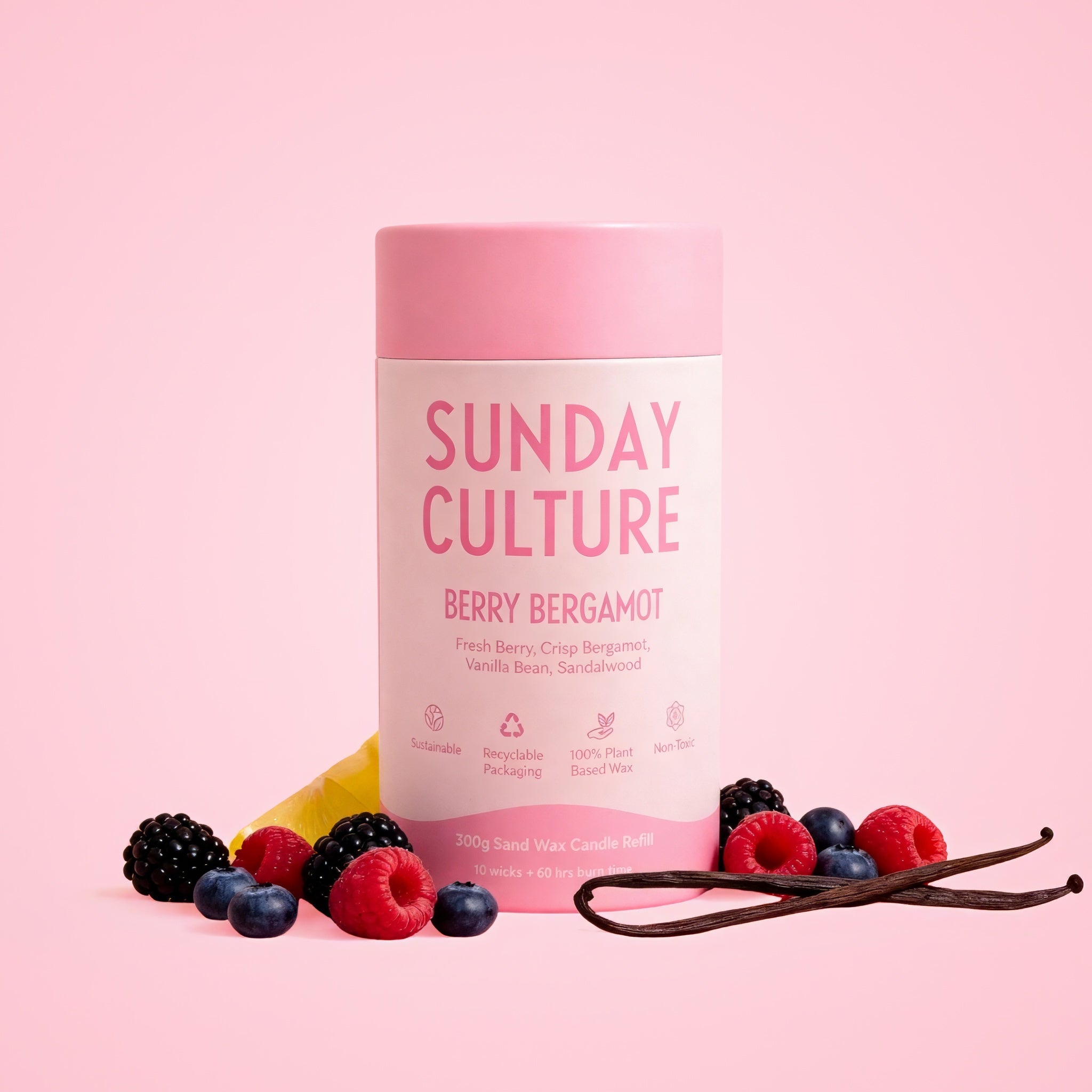 Sunday Culture berry bergamot product with berries and vanilla beans on a pink background